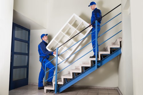 Commercial removals team transporting office equipment in North London