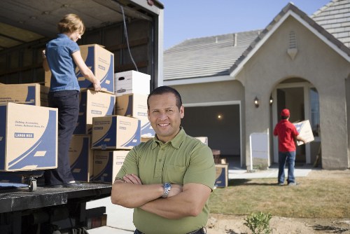 Packed moving boxes and furniture prepared for transport