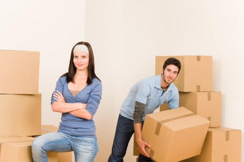 Movers loading furniture and boxes from a flat in Finsbury Park