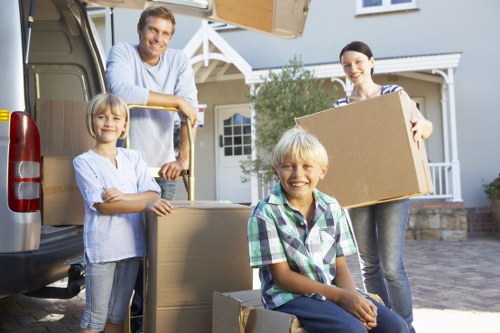 Packing and loading household items into a moving van