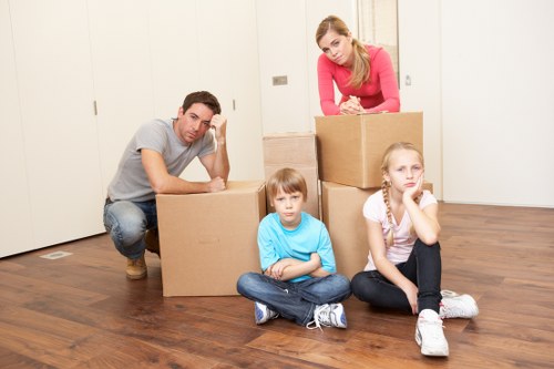 Careful loading of furniture into a removal van on a busy street