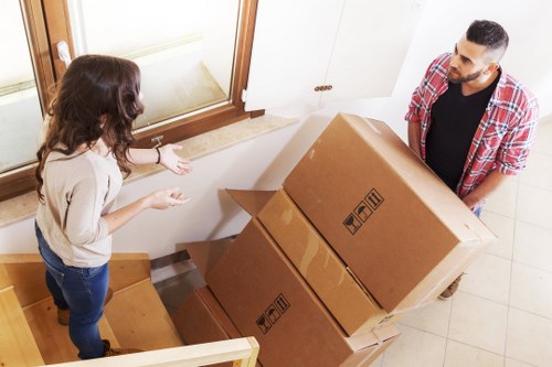 Team handling packed boxes with care during a house move